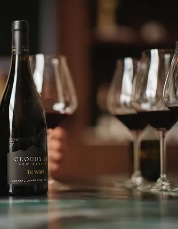 Two bottles of Cloudy Bay Te Wahi with Tasting glasses